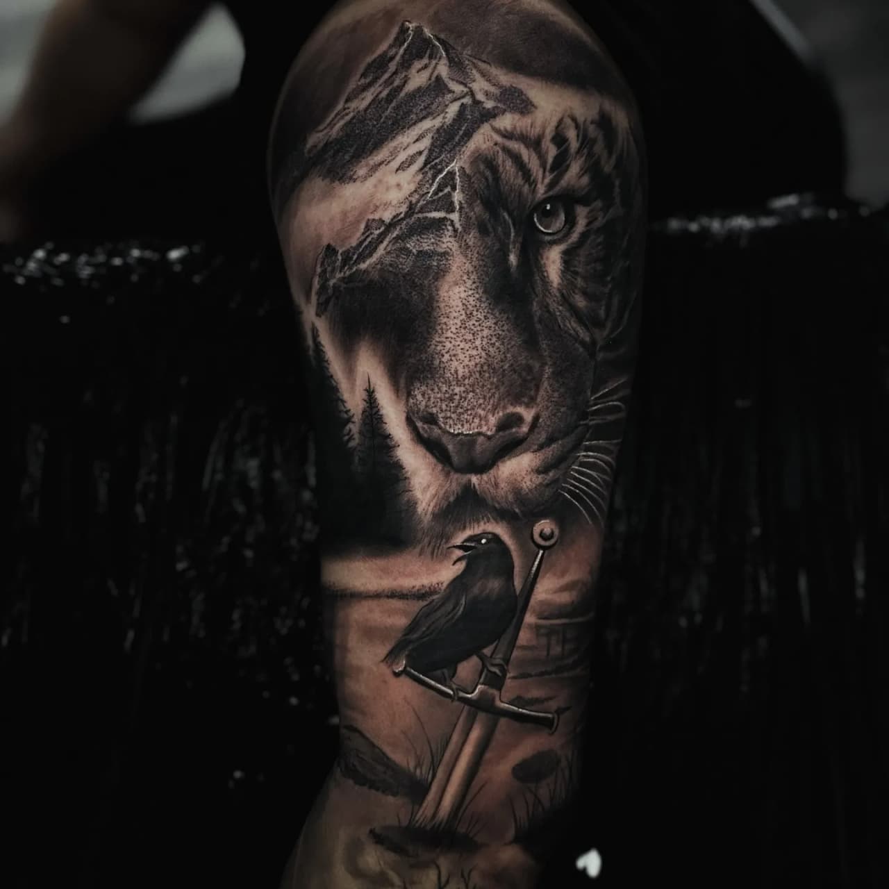 Realism tiger mountain and crow sleeve tattoo by Andrew Fernandez at Studio AZ Minneapolis